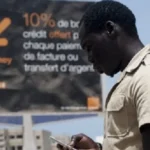 Affiche de promotion Orange Money dans le quartier de Ngor à Dakar, Sénégal