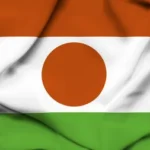 Drapeau du Niger aux couleurs orange, blanc et vert ondulant au vent